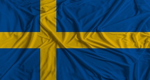 Swedish flag with fabric texture background. National flag of Sweden