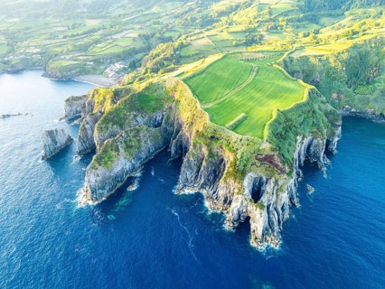 Cape Furado, Cliffs, Green Lush Fields, Pasturelands and Atlantic Ocean on Sunny Morning. Azores,