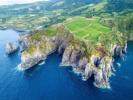 Cape Furado, Rocky Cliffs, Green Lush Fields, Pasturelands, Hills and Atlantic Ocean. Azores, Sao