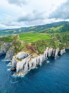Cape Furado, Cliffs, Green Lush Hills, Fields, Pasturelands and Atlantic Ocean. Azores, Sao Miguel