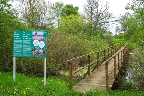 Information board and wooden bridge into the Krapje Dol nature reserve, Krapje, Sisak-Moslavina