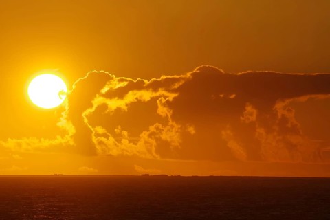 Bright sunset on the horizon with dramatic clouds, Orkney Islands, Scotland, Great Britain