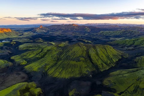Moss-covered landscape with mountains in the Icelandic Highlands, Iceland