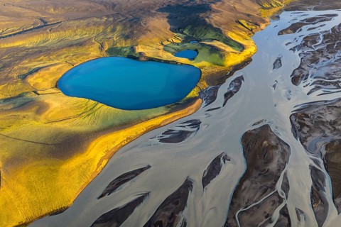Turquoise crater lake and glacial river, Icelandic Highlands, Iceland
