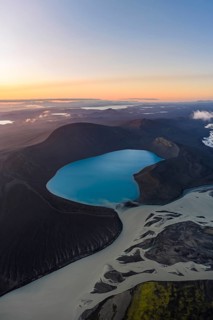 Turquoise crater lake Skyggnisvatn and glacial river, Icelandic Highlands, Iceland