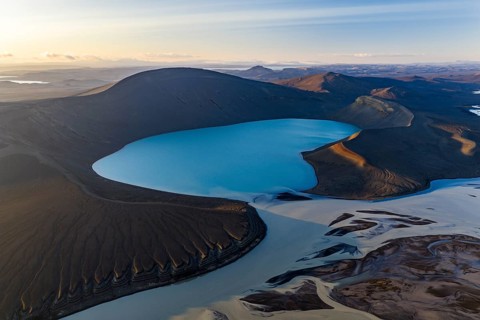 Turquoise crater lake Skyggnisvatn and glacial river, Icelandic Highlands, Iceland