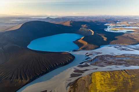 Turquoise crater lake Skyggnisvatn and glacial river, Icelandic Highlands, Iceland