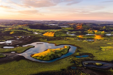 Mossy landscape and lakes at sunrise, Icelandic Highlands, Iceland