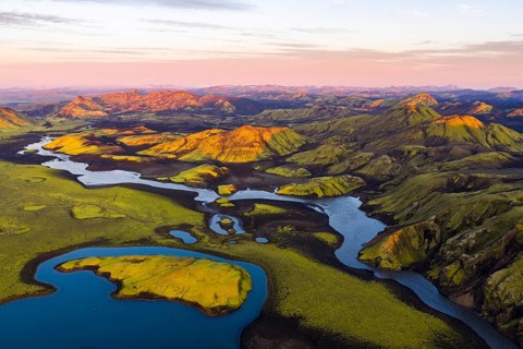 Mossy landscape and lakes at sunrise, Icelandic Highlands, Iceland