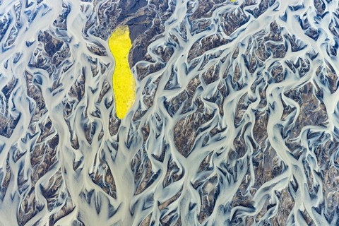 Small island in the branched course of a glacial river, South Iceland, Iceland