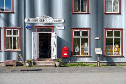 Shop window and entrance of the old bookshop in Flateyri, Westfjords, West Iceland, Iceland