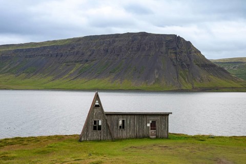 Old abandoned house by the fjord, Westfjords, West Iceland, Iceland