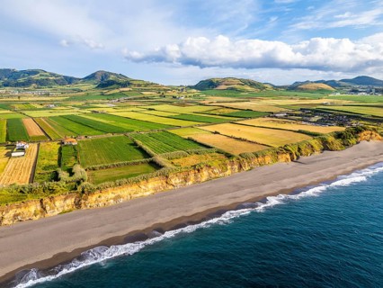 Areal de Santa Barbara Beach, Green Lush Fields and Atlantic Ocean. Azores, Sao Miguel Island.