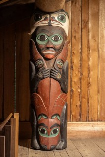 Totem poles in a Tlingit Clan House, Totem Bight State Historical Park, Ketchikan, Alaska, USA