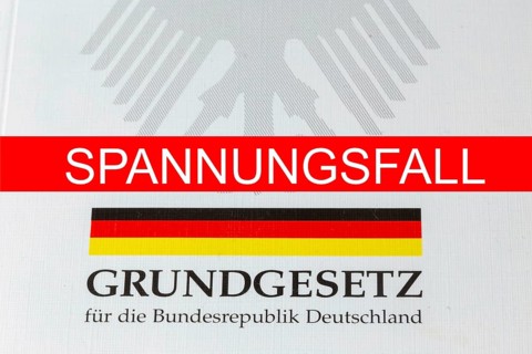 Tension case Symbolic image: SPANNUNGSFALL lettering, with the German Basic Law behind it