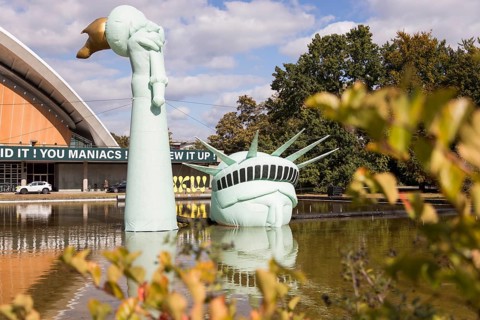 Symbolisation of a Statue of Liberty submerged in water in front of the Haus der Kulturen der Welt