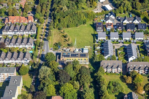 Aerial view, construction site with new building day care centre Villa Kunterbunt at