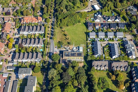Aerial view, construction site with new building day care centre Villa Kunterbunt at