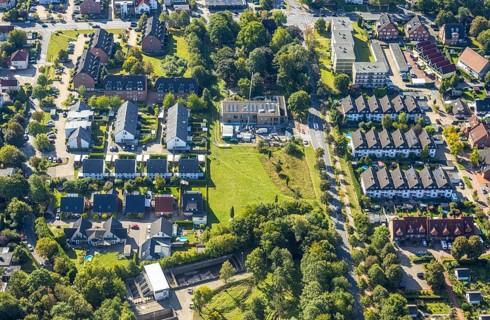 Aerial view, construction site with new building day care centre Villa Kunterbunt at