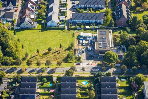 Aerial view, construction site with new building day care centre Villa Kunterbunt at