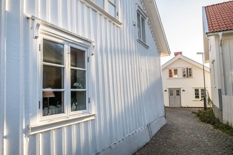 White wooden houses in the alleyways of Smögen, Smögenbryggan, Västra Götalands Län, Bohuslän,
