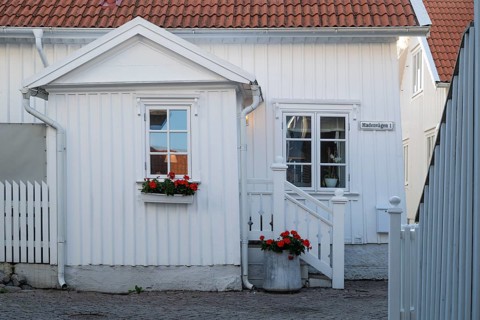 White wooden house in the alleys of Smögen, Smögenbryggan, Västra Götalands Län, Bohuslän, Sweden