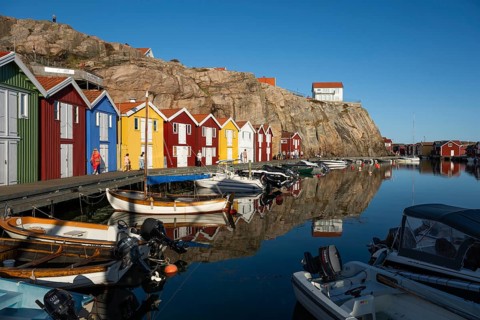 Boats and colourful boathouses in the harbour of Smögen, Smögenbryggan, Västra Götalands Län,