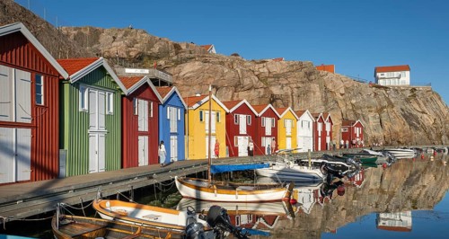 Boats and colourful boathouses in the harbour of Smögen, Smögenbryggan, Västra Götalands Län,