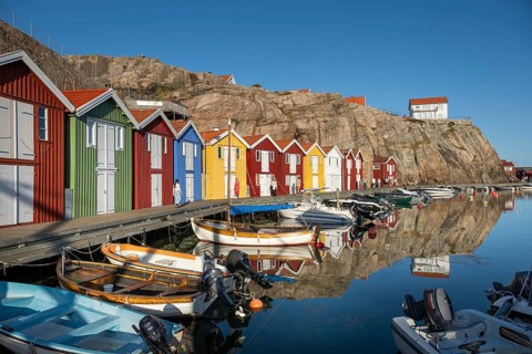Boats and colourful boathouses in the harbour of Smögen, Smögenbryggan, Västra Götalands Län,