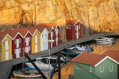 Colourful boathouses and boats in the harbour of Smögen, evening mood, Smögenbryggan, Västra