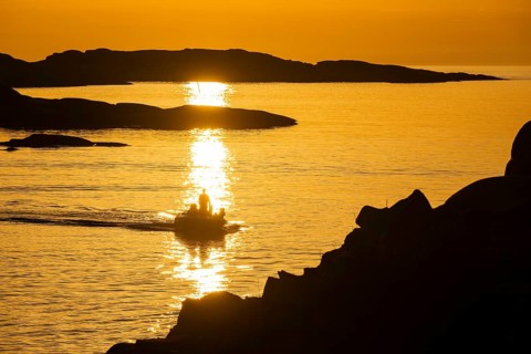 Motorboat between archipelago at sunset, archipelago landscape, Smögen, Smögenbryggan, Västra