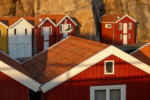 Colourful boathouses between rocks in the harbour of Smögen, Smögenbryggan, Västra Götalands Län,