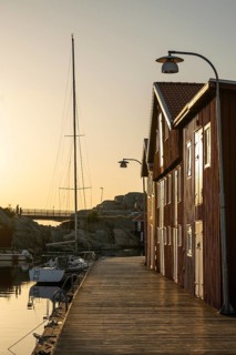 Boats and boathouses in the harbour of Smögen, Smögenbryggan, Västra Götalands Län, Bohuslän,