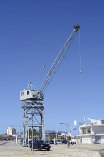 Old harbour crane with a white stork nest, Portimao, Algarve, Portugal