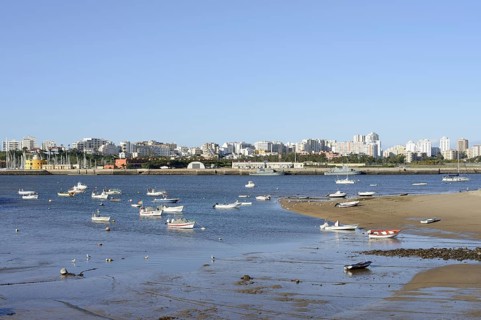 View over the mouth of the river Arade with fishing boats to Portimao, Ferragudo, Algarve, Portugal
