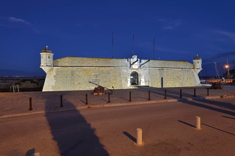 Forte da Ponta da Bandeira fortress by night, Lagos, Algarve, Portugal
