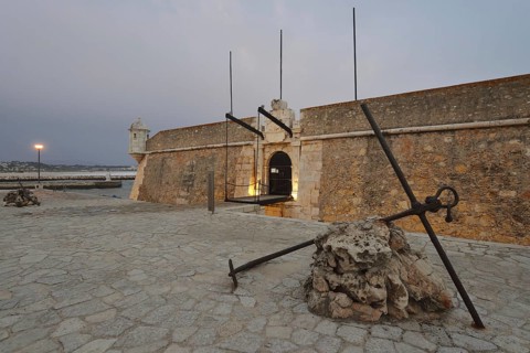 Forte da Ponta da Bandeira fortress at dusk, Lagos, Algarve, Portugal