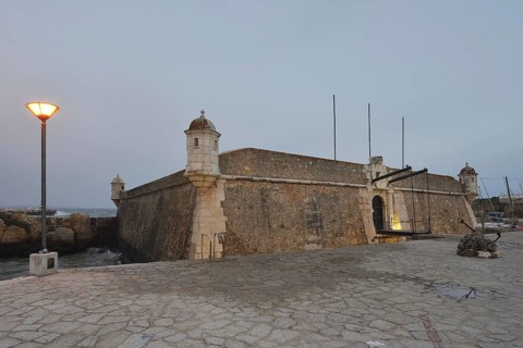Forte da Ponta da Bandeira fortress at dusk, Lagos, Algarve, Portugal