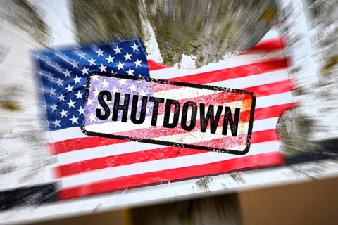 Torn sticker of US flag with shutdown printed on it, photomontage