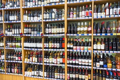 A large shelf filled with different bottles of wine in a shop, Gntunik supermarket, Aragazotn