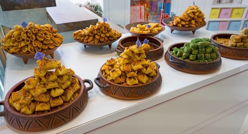 Traditional sweets arranged in decorative bowls in a display, Gntunik supermarket, Aragazotn