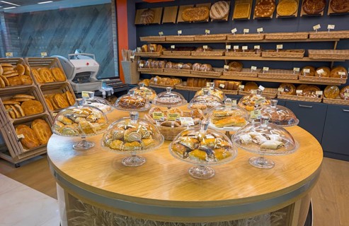Various pastries and breads are decoratively displayed in a bakery, Gntunik supermarket, Aragazotn