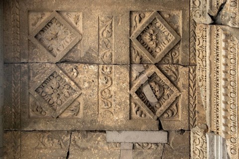 Fragment of the wall of an ancient temple with stucco, Geghard, Armenia