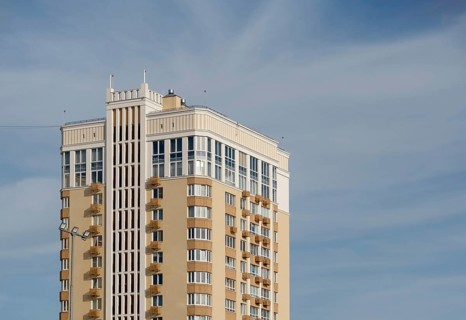 Modern multi-storey building against sky, copy space