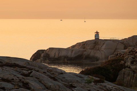 Small lighthouse at sunset, archipelago, Smögen, Smögenbryggan, Västra Götalands Län, Bohuslän,