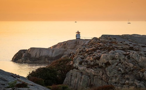 Small lighthouse at sunset, archipelago, Smögen, Smögenbryggan, Västra Götalands Län, Bohuslän,