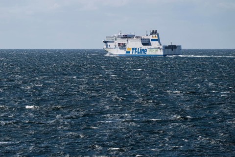 LNG-powered TT-Line ferry travelling across a gently moving blue sea, near Warnemünde, Rostock,