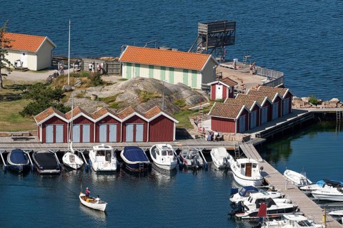 Small harbour with boats, boathouses and lido, Fjällbacka, Bohuslän, West Sweden, Sweden