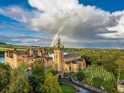 Rainbow over Linlithgow Palace from a drone, Linlithgow Loch, West Lothian, Scotland, United
