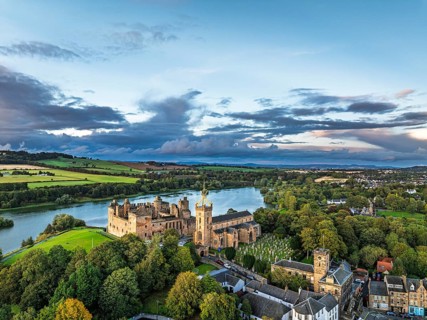 Sunset over Linlithgow Palace from a drone, Linlithgow Loch, West Lothian, Scotland, United Kingdom